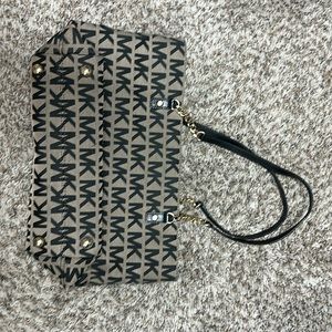 Authentic Michael Michael Kors hand bag, black, grey, and gold